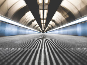 Image taken from floor perspective on an airport moving walkway.