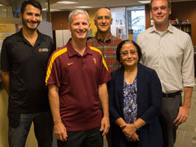 Five researchers posing together.